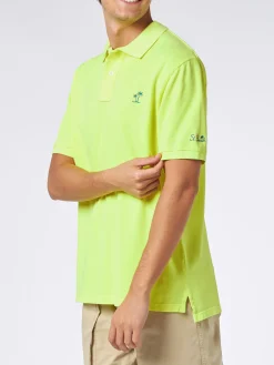 Polo da uomo in piquet giallo fluo con logo St. Barth ed effetto vintage
