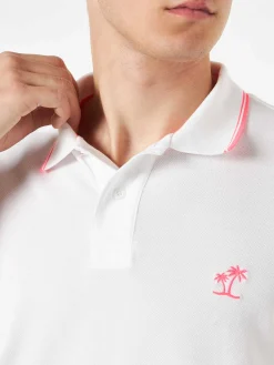 Polo in piquet bianco con ricamo palme