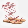 Sandali flat avvolgenti con strass fucsia